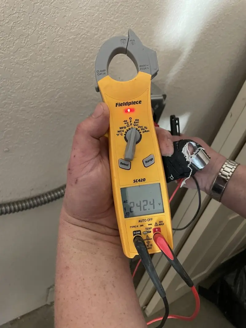 Voltage testing with clamp meter during Ceiling Fan Installation in Clifton